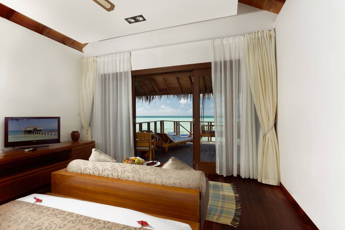 water villa | living area | flat-screen tv, dvd player