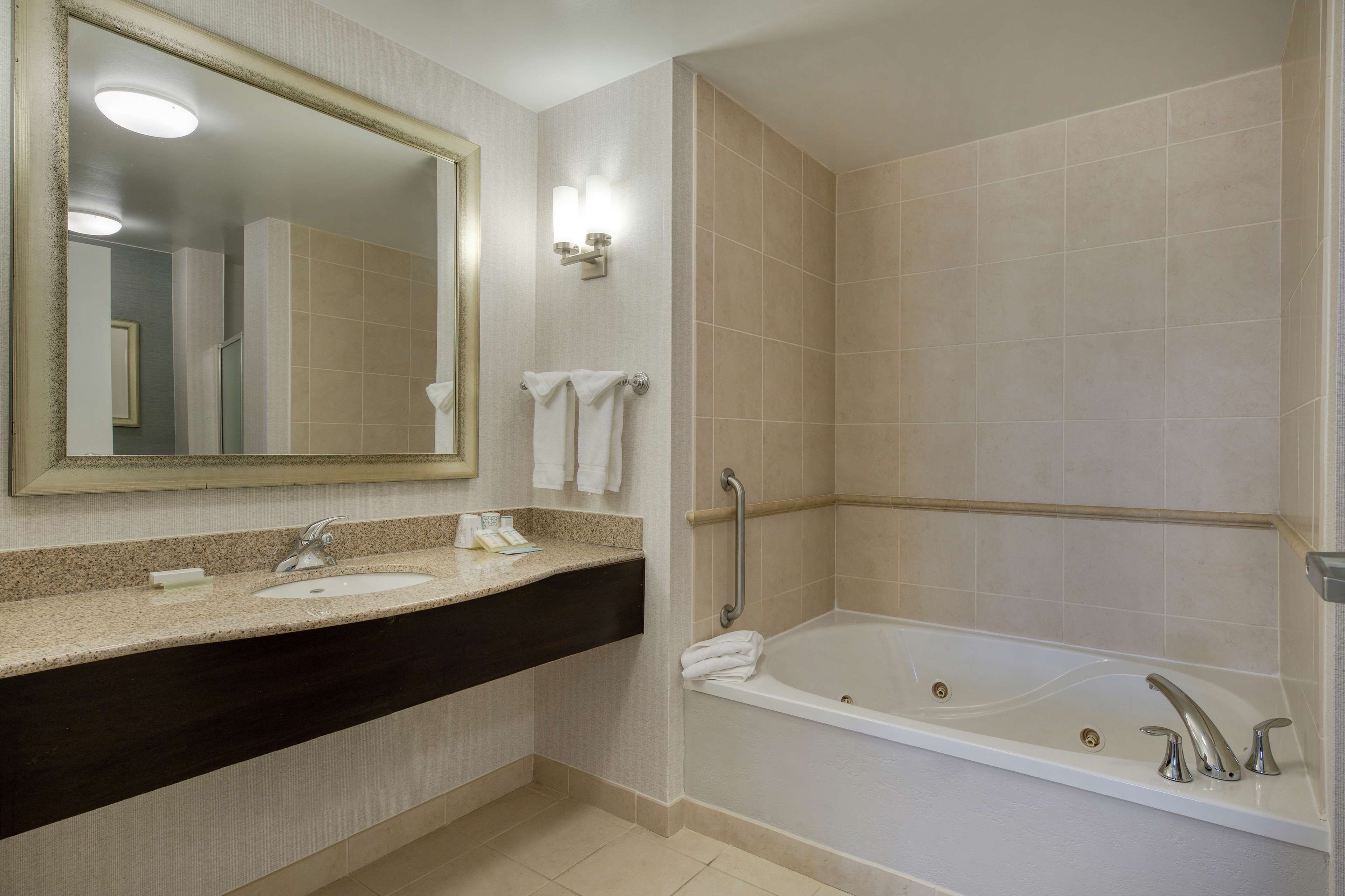 one bedroom suite | bathroom | shower, free toiletries, hair dryer, towels