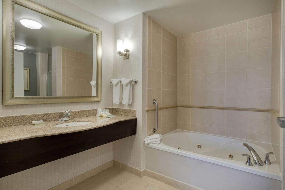 one bedroom suite | bathroom | shower, free toiletries, hair dryer, towels