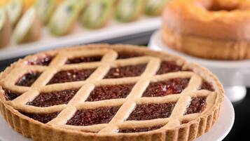 A pie with a lattice crust on a plate.