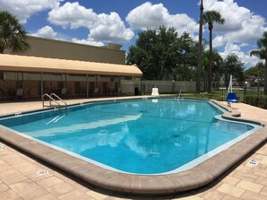 Outdoor pool, pool loungers - Rodeway Inn Sun City Center (Sun City Center)