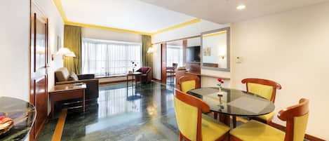 Luxury Suite | Living area | 32-inch LED TV with satellite channels, TV