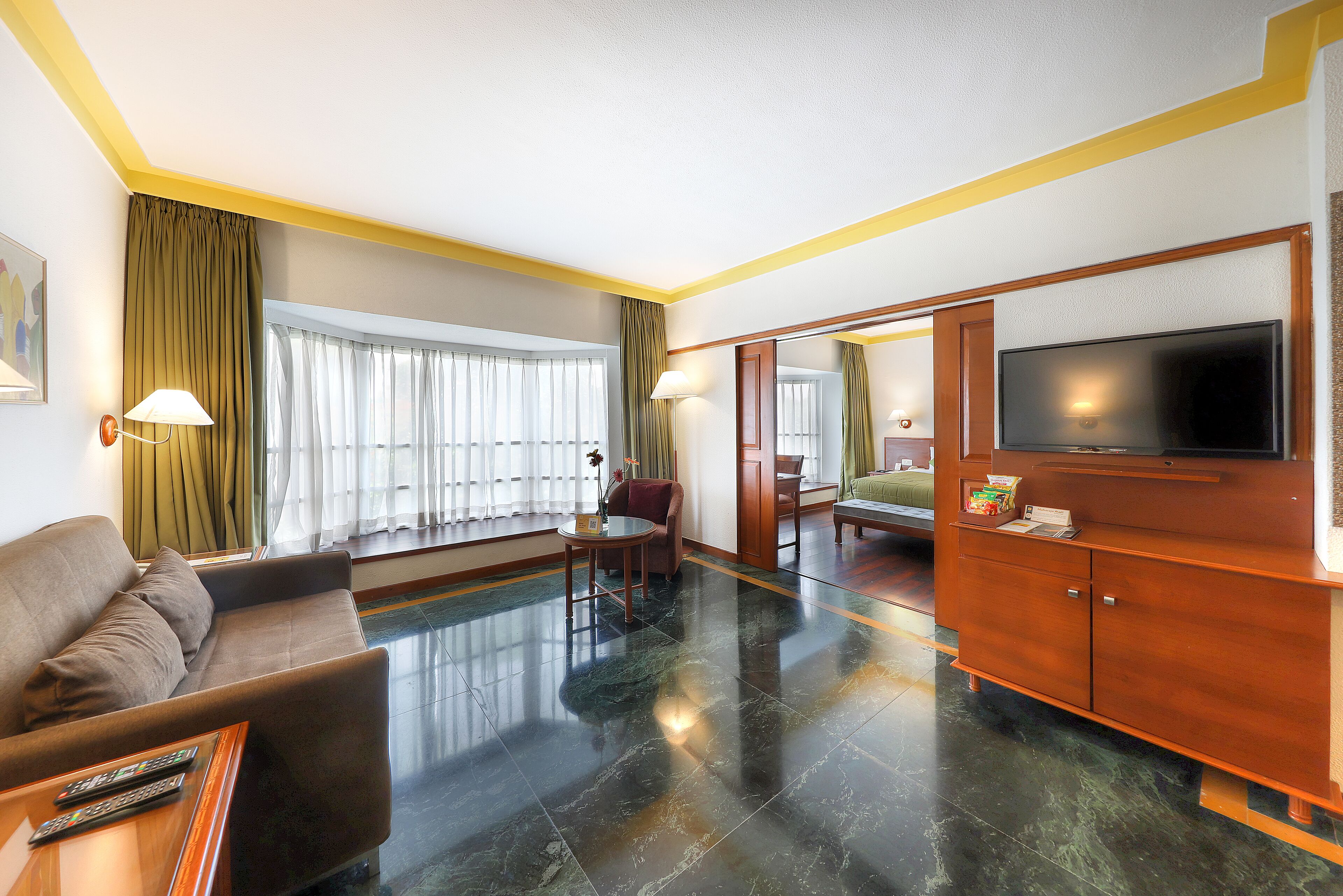Luxury Suite | Living area | 32-inch LED TV with satellite channels, TV