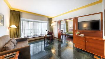 Luxury Suite | Living area | 32-inch LED TV with satellite channels, TV