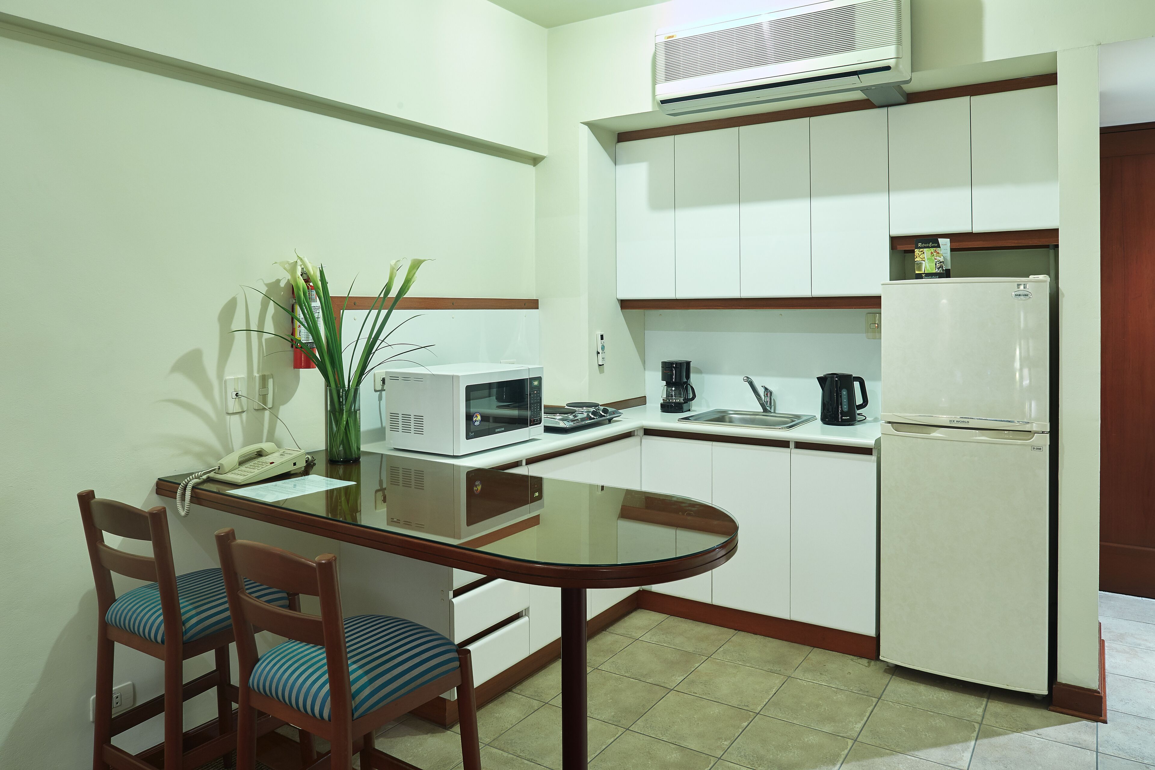 suite, 1 queen bed | private kitchenette | full-sized fridge, microwave, stovetop