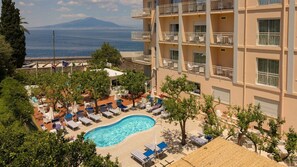Seasonal outdoor pool, pool umbrellas, pool loungers