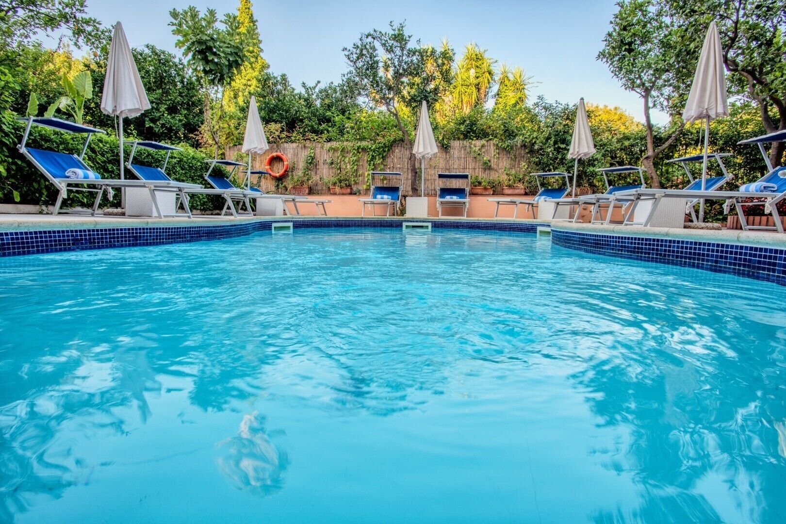 Seasonal outdoor pool, pool umbrellas, sun loungers