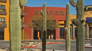 A building labeled "CONFERENCE CENTER" with cacti in the foreground.