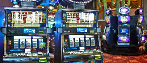 A row of slot machines with the "Triple Lucky" logo, a cactus decoration, and a "Collect Ticket" sign.