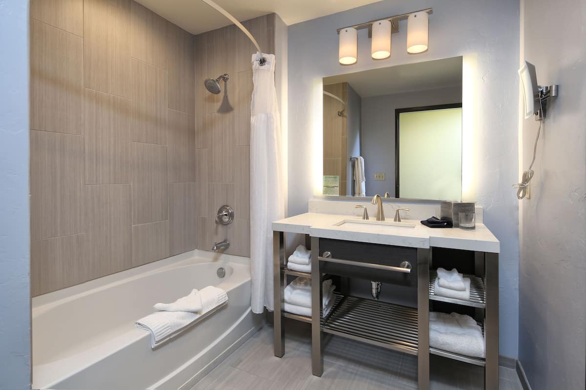 deluxe room, 2 queen beds | bathroom | free toiletries, hair dryer, towels