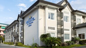 A hotel with a modern facade, featuring a prominent sign for 'MICRODEK HOTEL'. - Microtel by Wyndham Davao (Davao)
