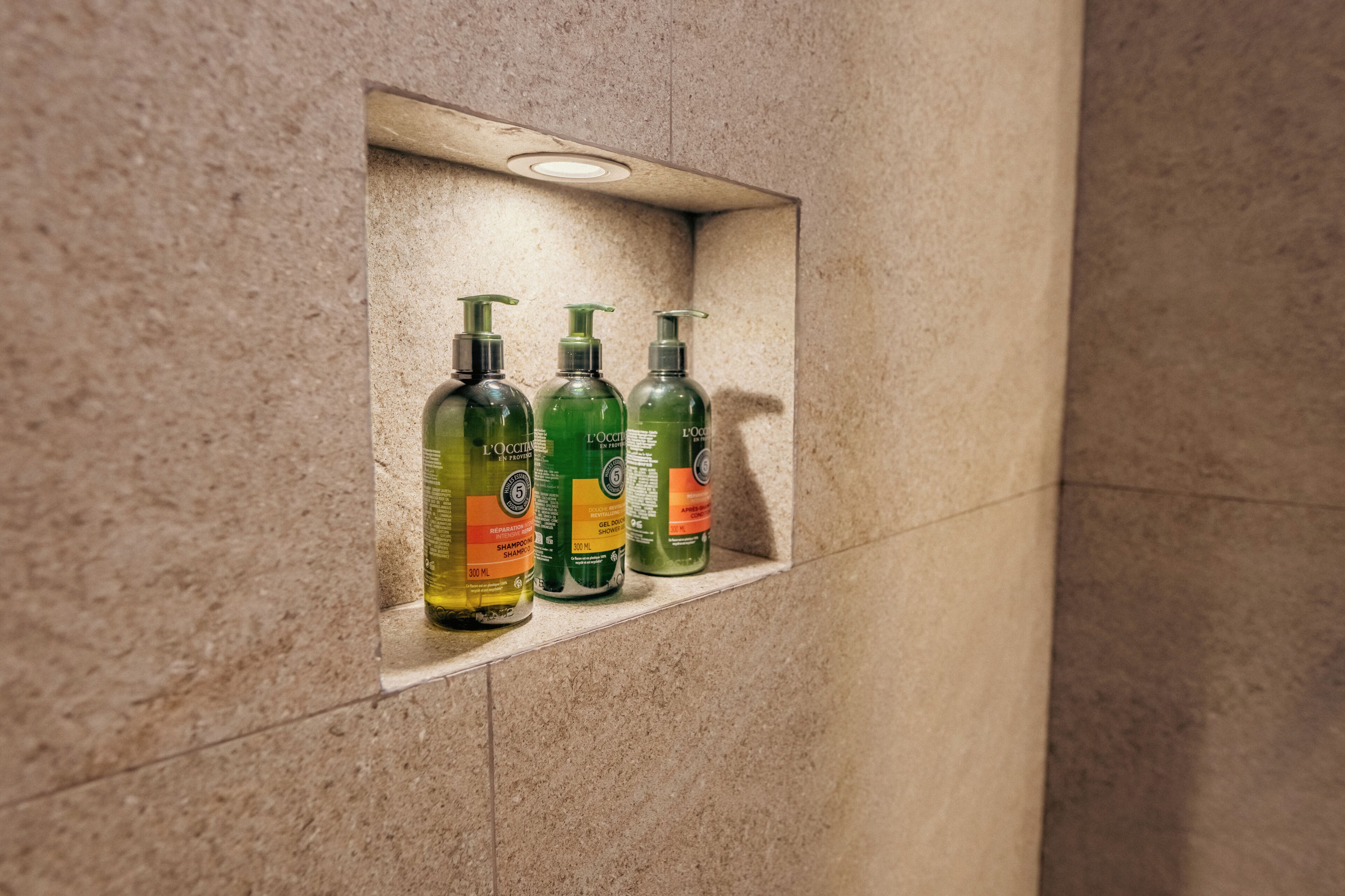 combined shower/bathtub, designer toiletries, hair dryer, towels