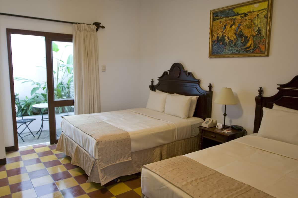 Room, 2 Queen Beds | Bathroom | Shower, free toiletries, hair dryer, towels