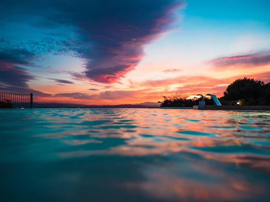 Seasonal outdoor pool, pool umbrellas, pool loungers