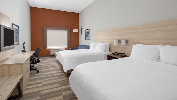 A hotel room with two beds, a desk, a chair, a TV, and a window. - Holiday Inn Express and Suites Ontario Airport by IHG (Ontario)