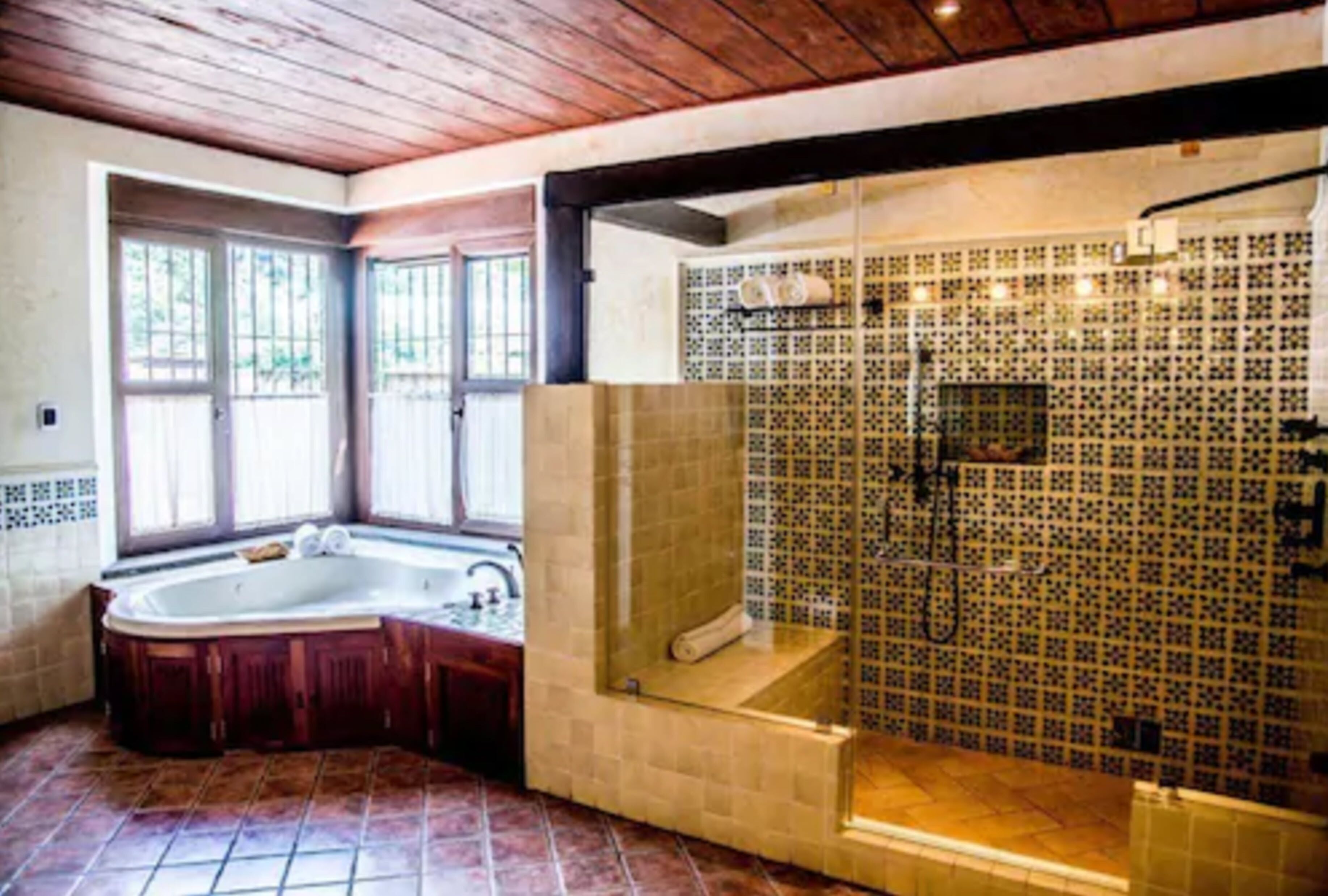 suite, 1 king bed | bathroom | shower, rainfall showerhead, hair dryer, dressing gowns