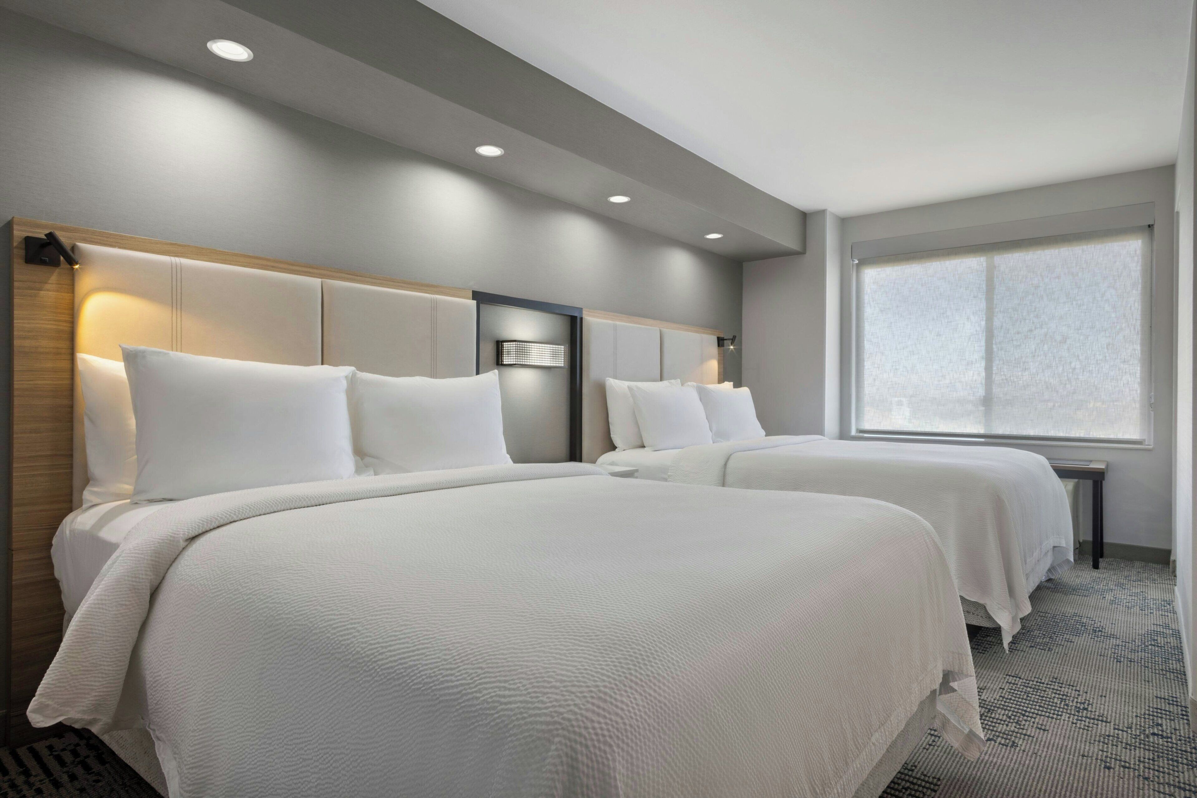 pillow-top beds, desk, blackout curtains, iron/ironing board