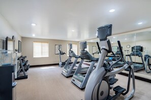 A gym with treadmills, dumbbells, and a water dispenser. - Staybridge Suites Augusta by IHG (Augusta)