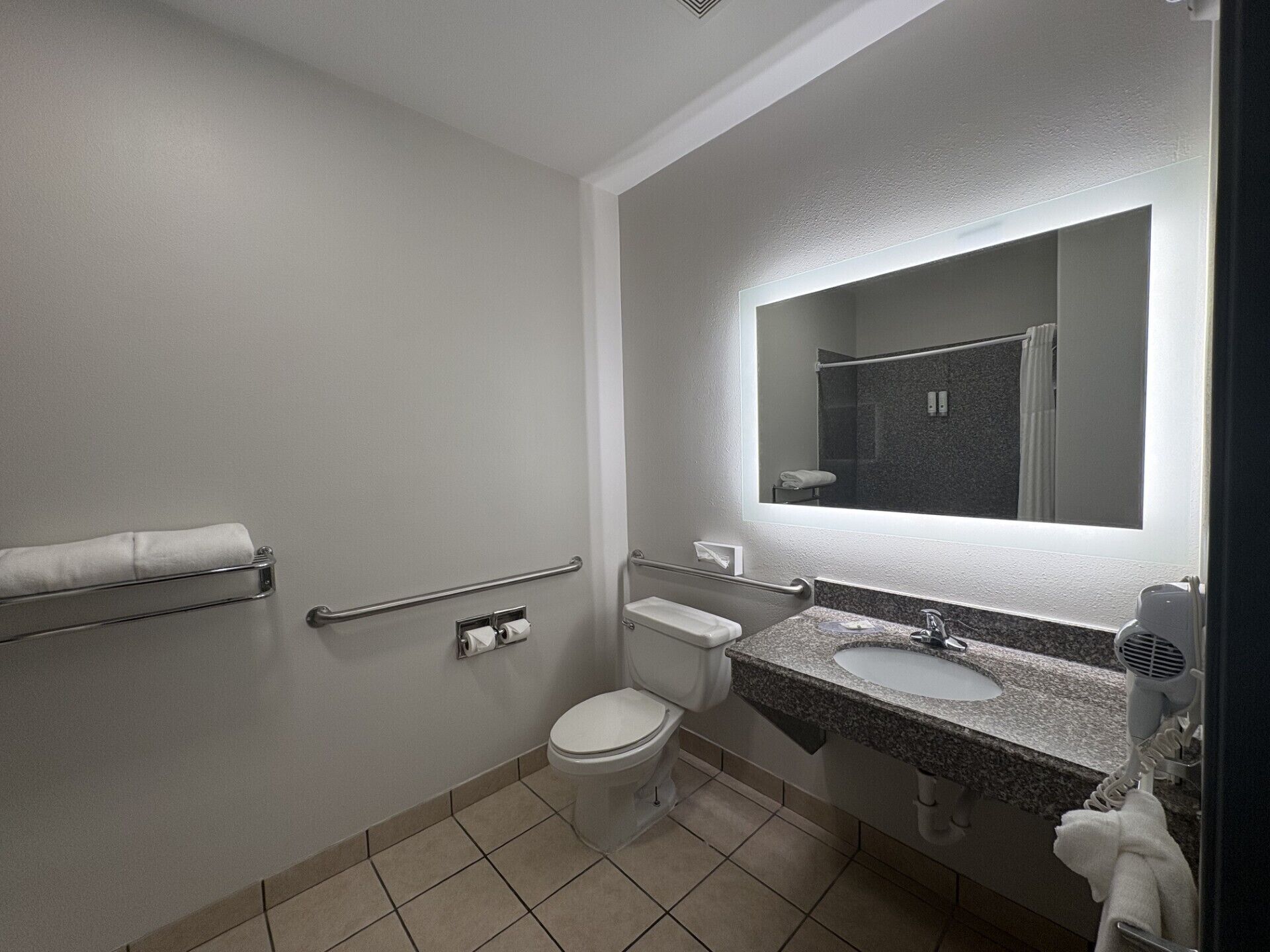 eco-friendly toiletries, hair dryer, towels