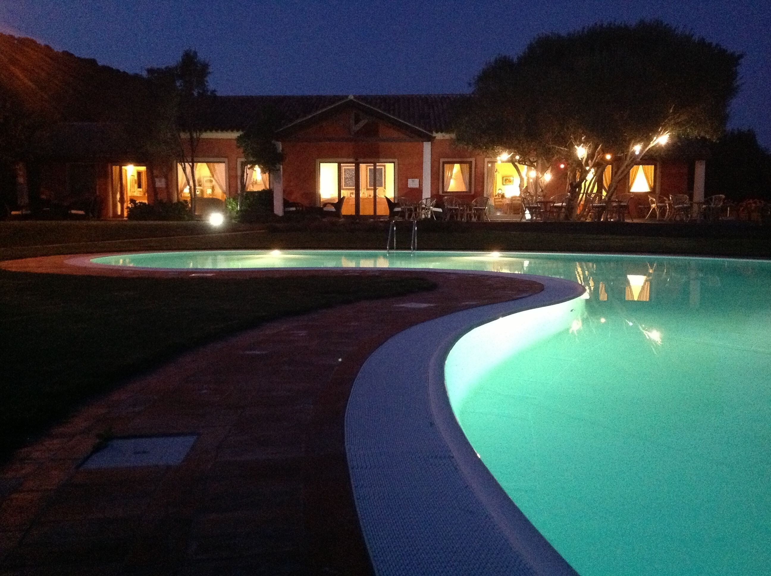 seasonal outdoor pool, a rooftop pool, pool umbrellas, pool loungers