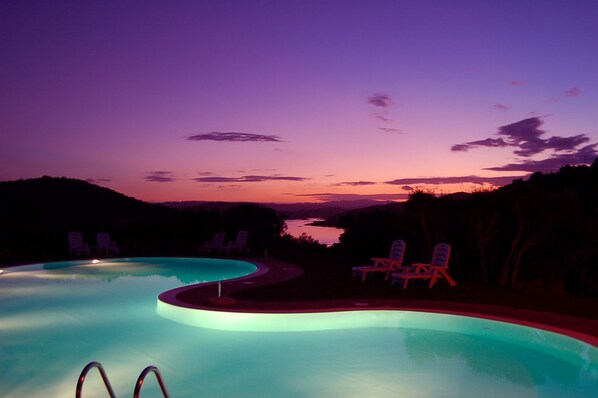 Seasonal outdoor pool, a rooftop pool, pool umbrellas, pool loungers