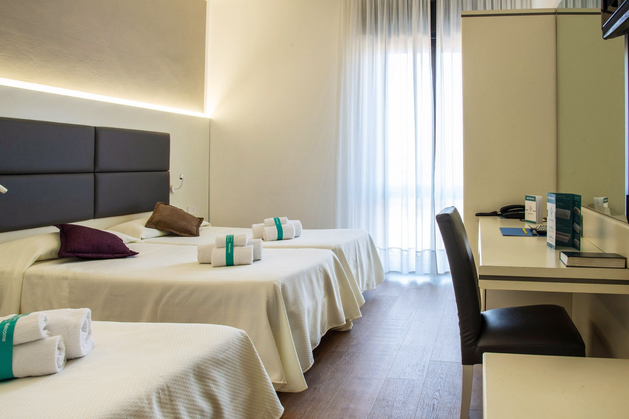 standard triple room, balcony | in-room safe, desk, soundproofing, rollaway beds