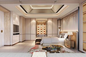 Une chambre moderne avec un lit, des tables de chevet, un téléviseur et un mur décoratif.