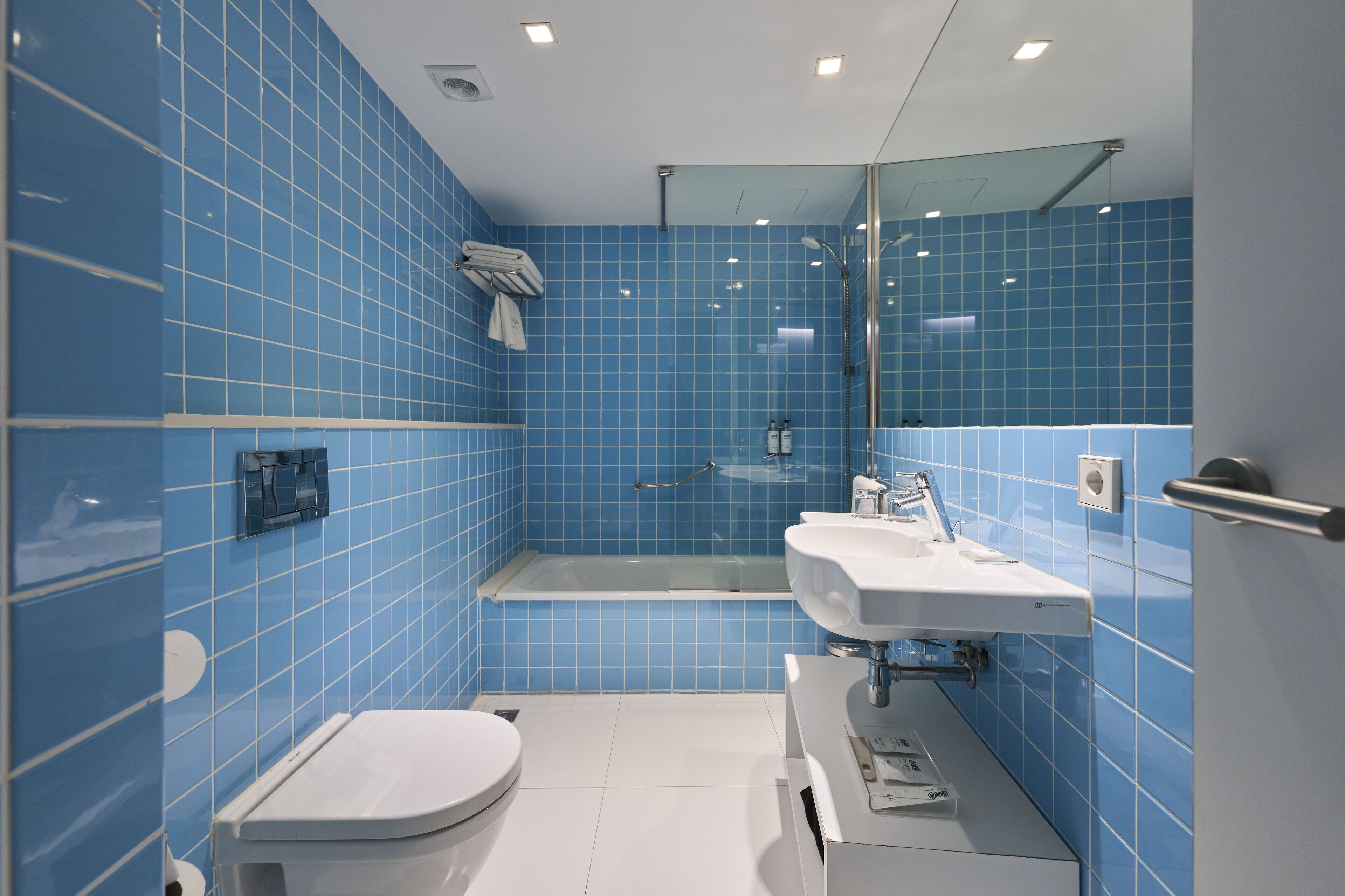 eco-friendly toiletries, hair dryer, towels