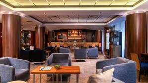 A modern lobby with seating, a reception desk, and a bar area. - Clarion Congress Hotel Olomouc (Olomouc)
