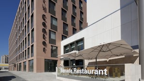 A modern building with a sign reading "Center Hotel" and a Benada Restaurant adjacent to it. - Clarion Congress Hotel Olomouc (Olomouc)