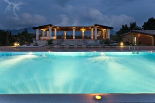 Seasonal outdoor pool, open 10:00 AM to 6:00 PM, pool umbrellas