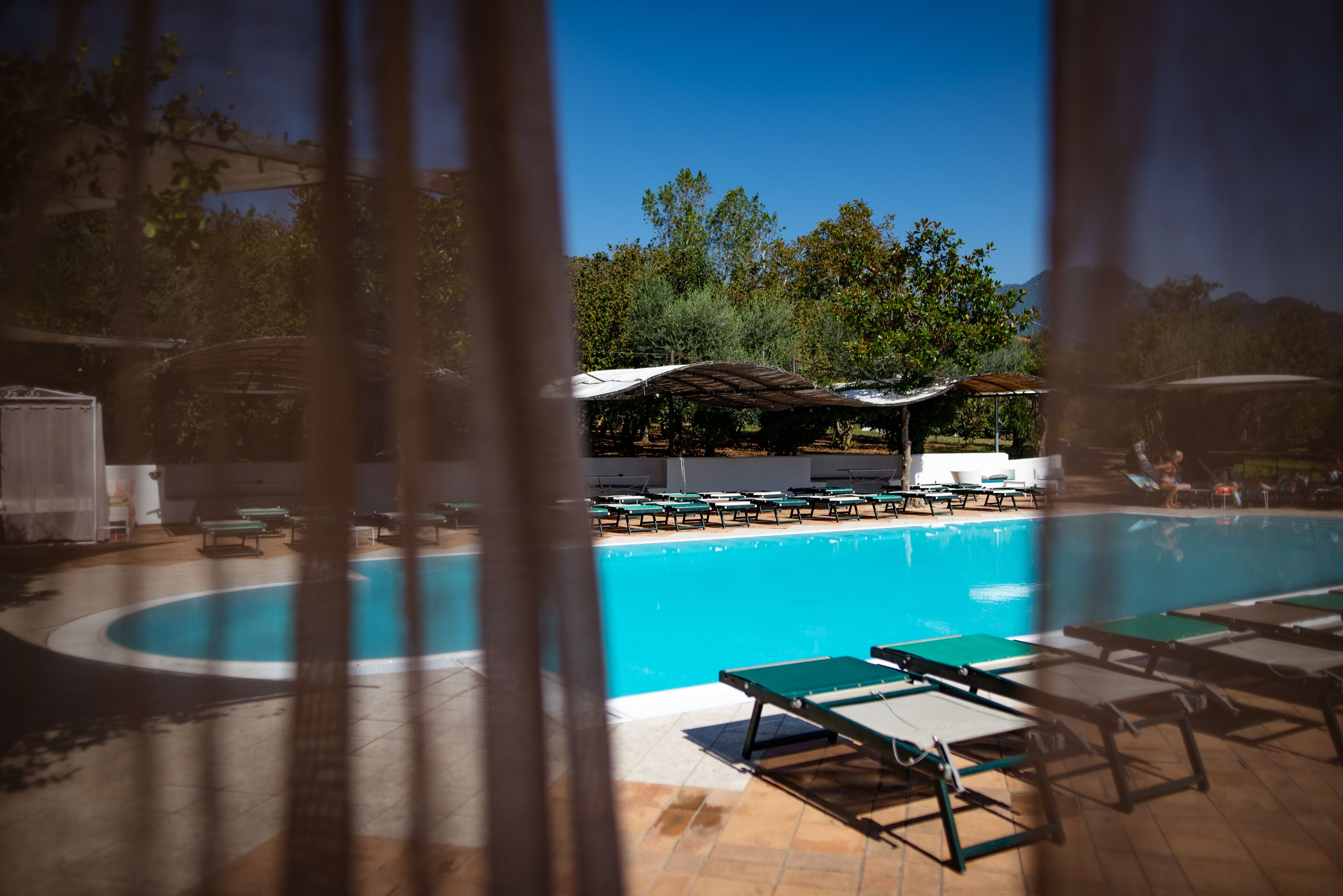 seasonal outdoor pool, open 10:00 am to 6:00 pm, pool umbrellas