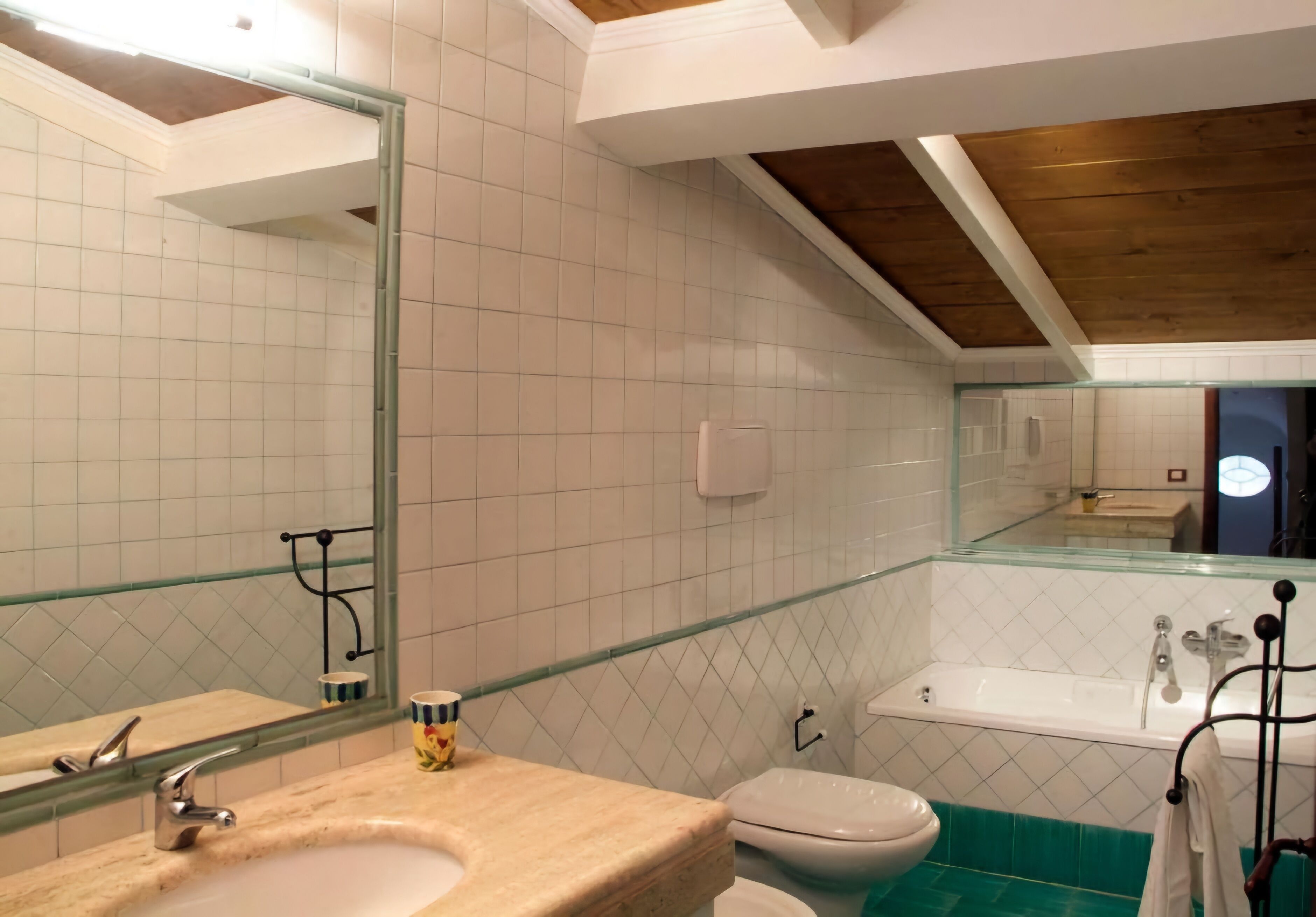 A bathroom with a sink, toilet, and bathtub.