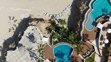 2 outdoor pools, open 7:00 AM to 10:00 PM, pool umbrellas, pool loungers