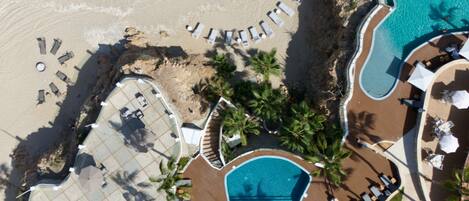 2 outdoor pools, open 7:00 AM to 10:00 PM, pool umbrellas, pool loungers