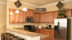 Coffee/tea maker, full-size fridge, microwave, stovetop - Village of Crystal Beach by Wyndham Vacation Rentals (Destin)