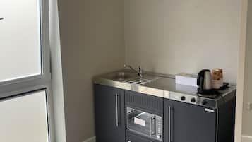 Classic Triple Room | Private kitchen | Fridge, coffee/tea maker