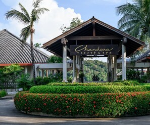 A resort entrance with a sign reading "Chandara Resort & Spa".