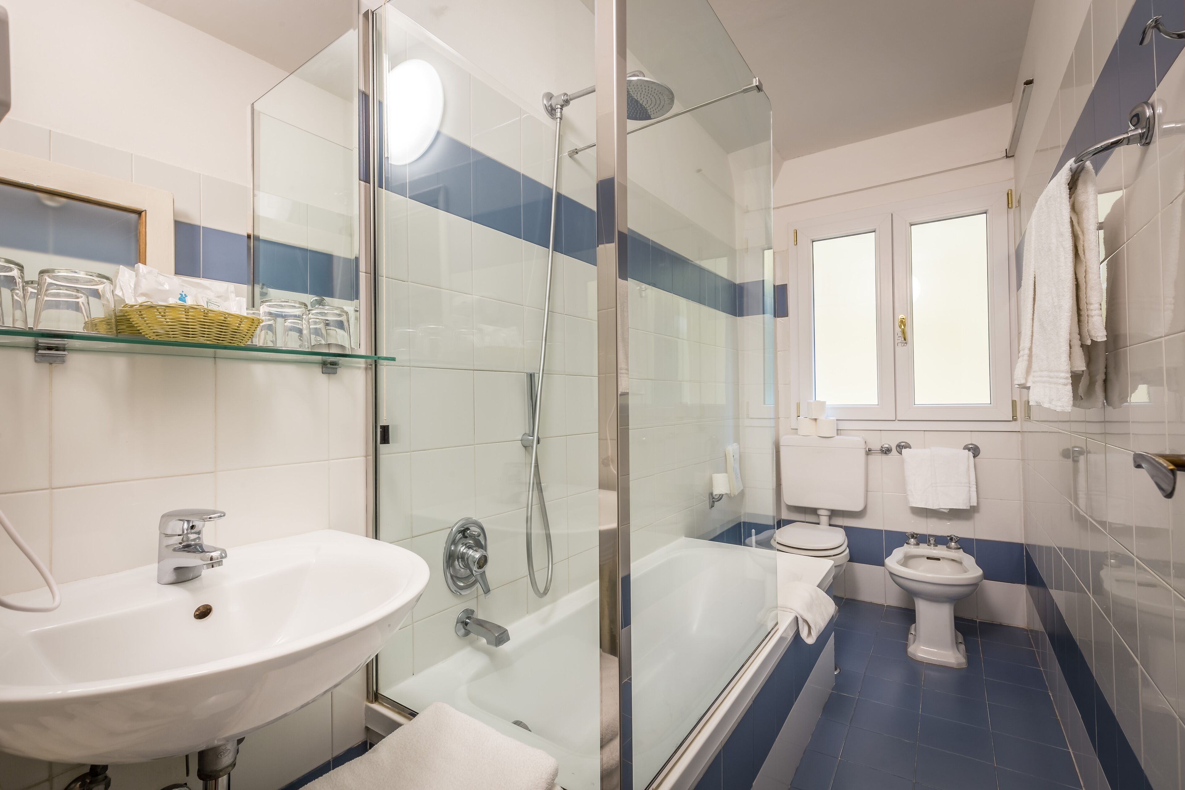 quadruple room | bathroom | hair dryer, bidet, towels, soap