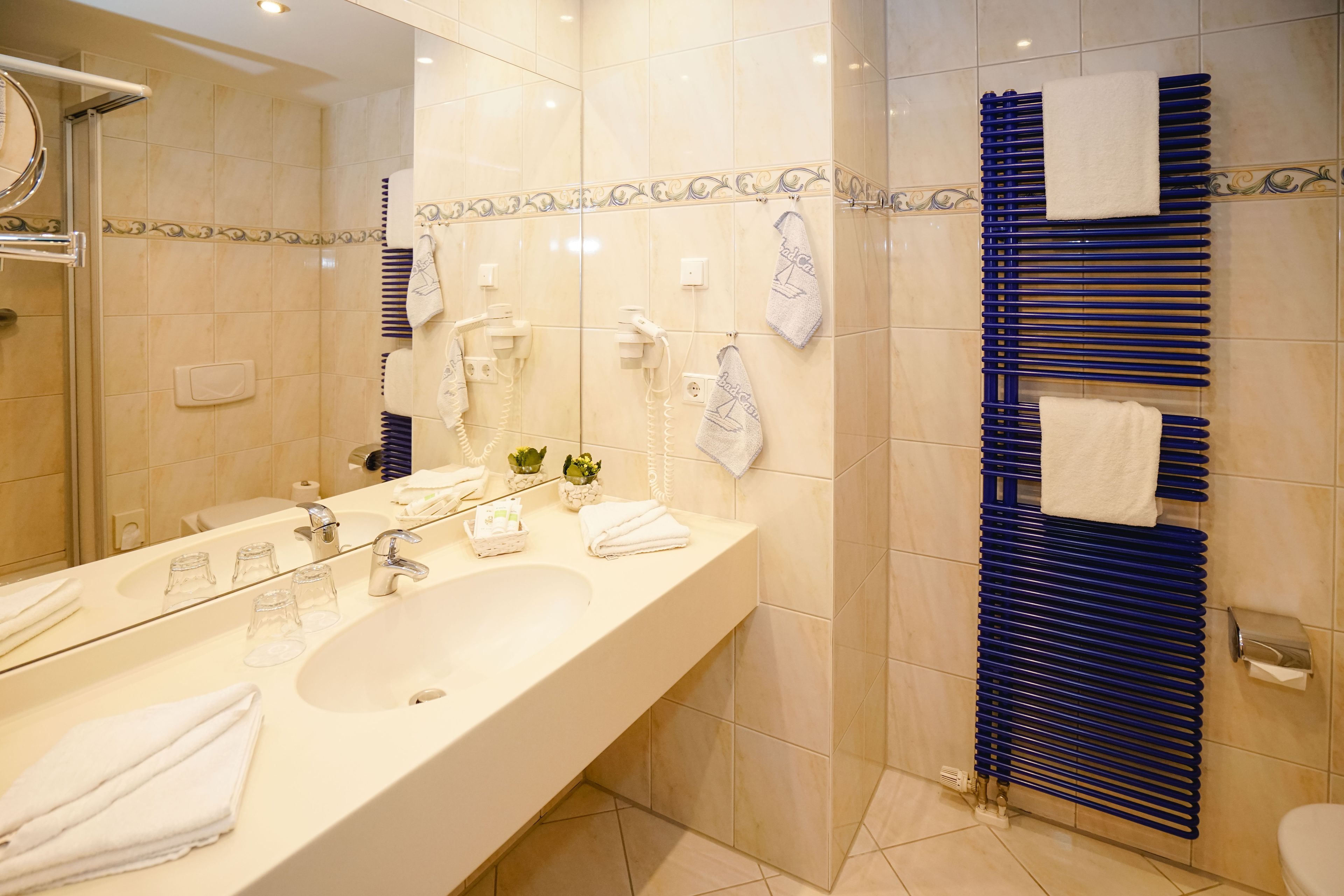 shower, free toiletries, bathrobes, slippers