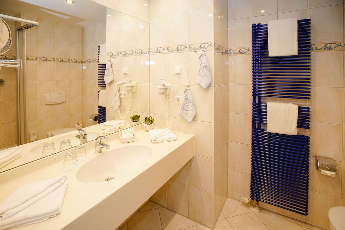 shower, free toiletries, bathrobes, slippers