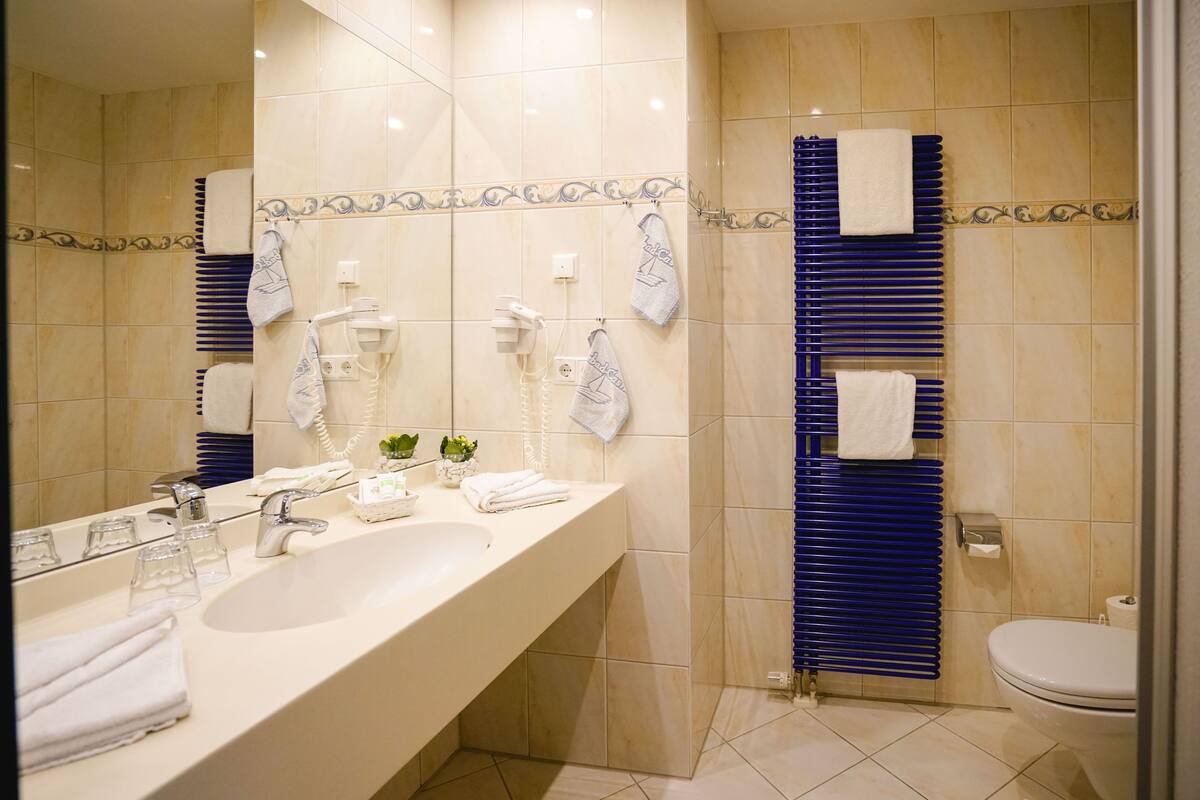 shower, free toiletries, bathrobes, slippers