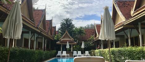 Outdoor pool, open 7:00 AM to 8:00 PM, pool umbrellas, pool loungers