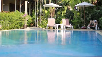 Outdoor pool, open 7:00 AM to 8:00 PM, pool umbrellas, pool loungers