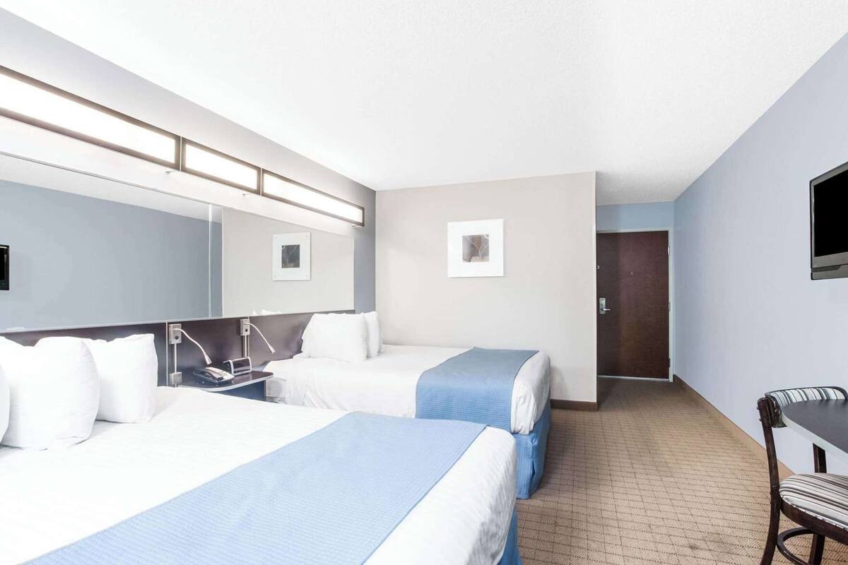 Premium bedding, pillowtop beds, desk, blackout drapes