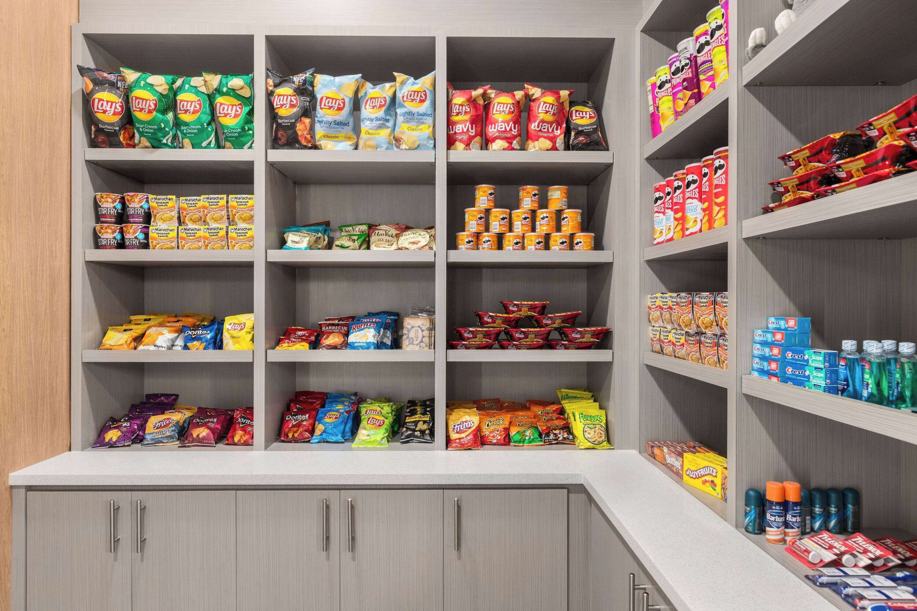 A snack and beverage section with various brands of chips, snacks, and drinks.
