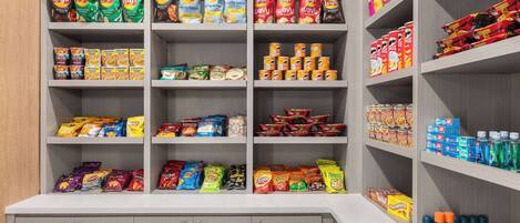 A snack and beverage section with various brands of chips, snacks, and drinks.