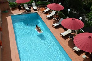 Seasonal outdoor pool, pool umbrellas