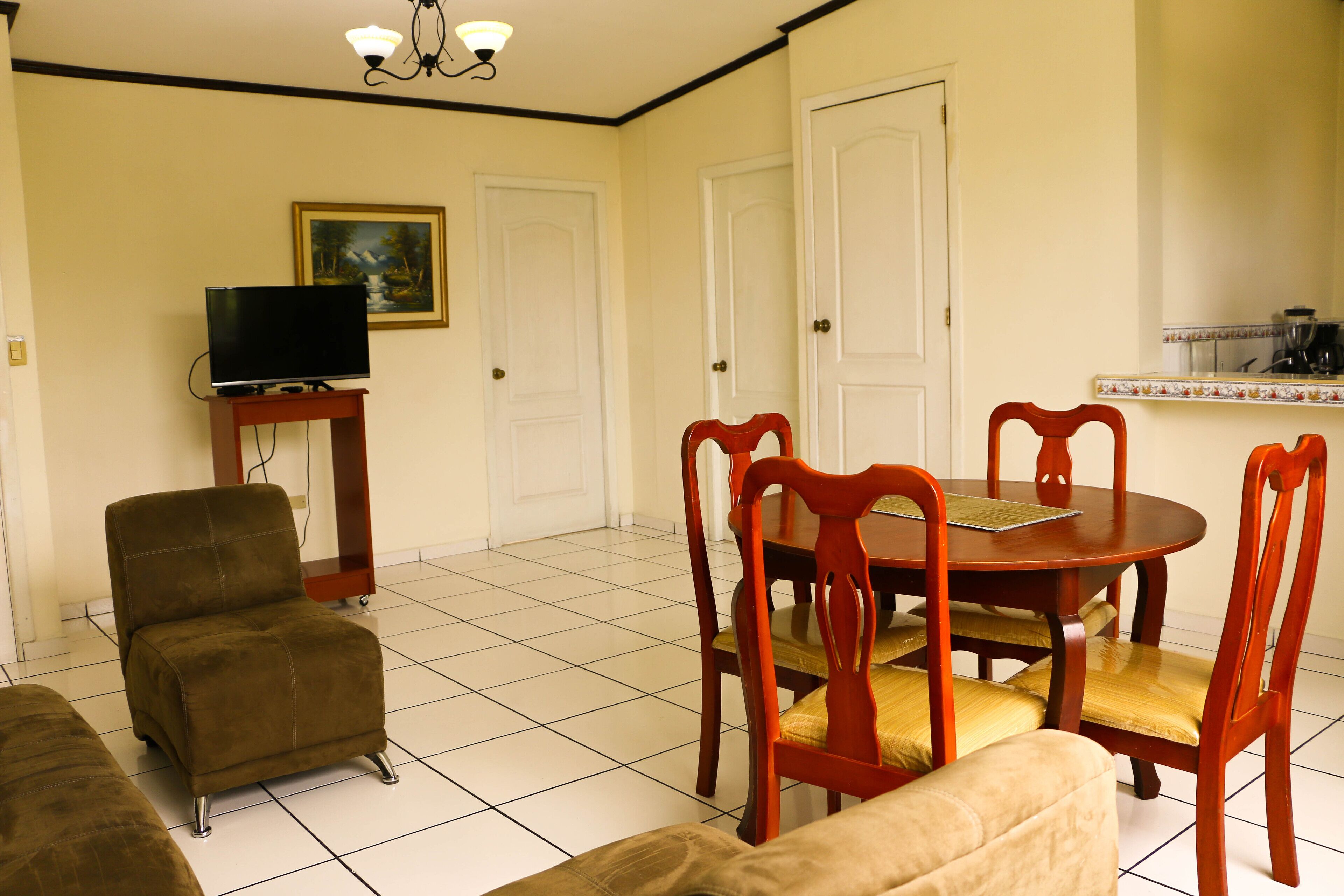 deluxe apartment | living area | 32-inch lcd tv with cable channels, tv