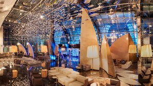 A spacious lobby with modern seating arrangements and a ceiling adorned with hanging lights. - Sahara Star (Mumbai)